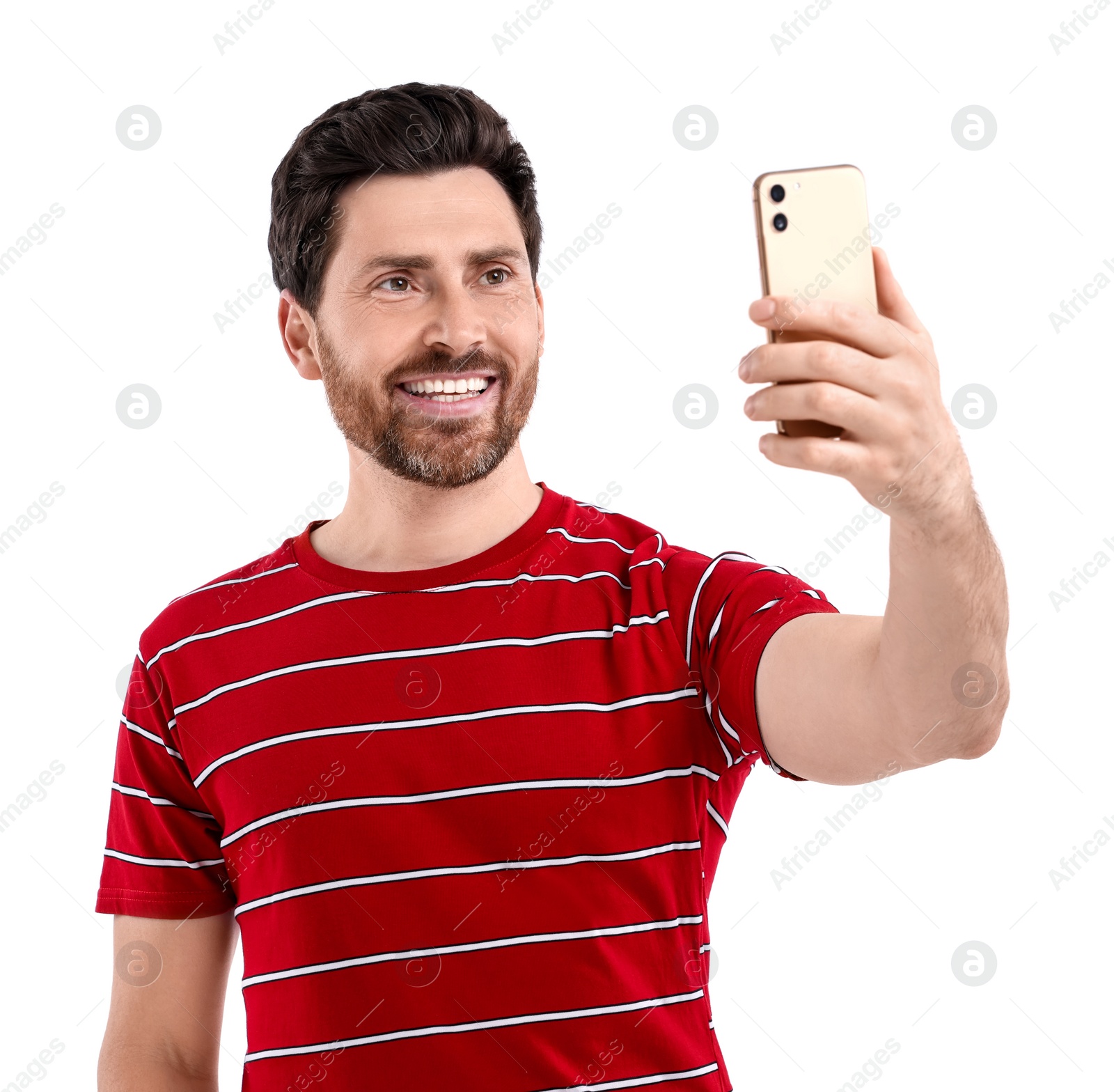 Photo of Smiling man taking selfie with smartphone on white background