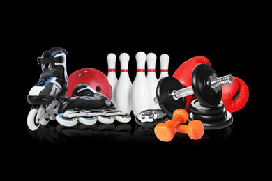 Image of Set of different sport equipment on black background