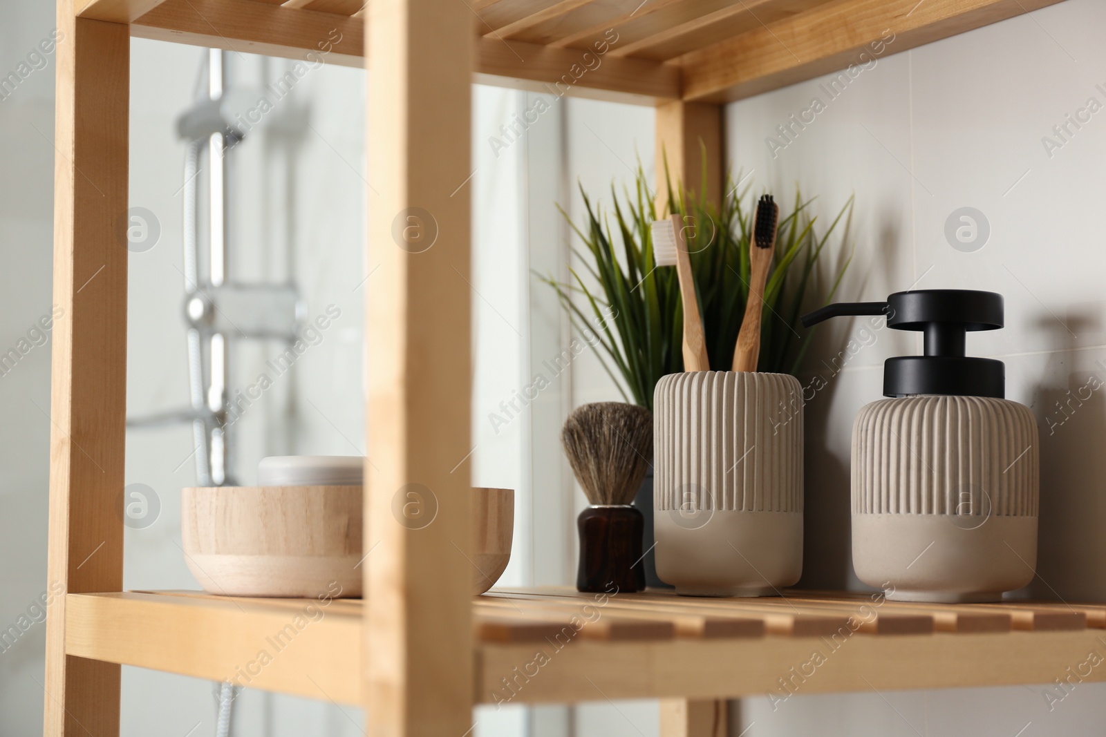 Photo of Shelving unit with toiletries in bathroom interior