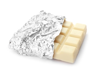 Delicious chocolate bar in foil on white background