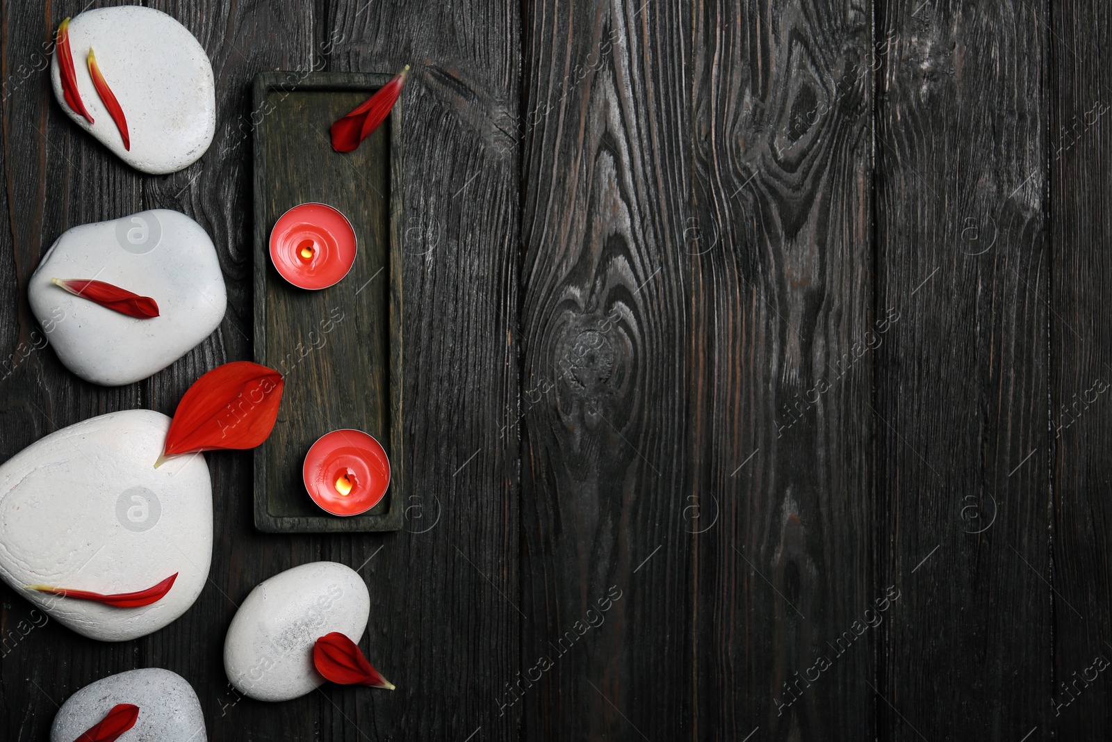 Photo of Flat lay composition with spa stones and space for text on wooden background