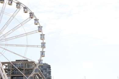 Photo of Cologne, Germany - August 28, 2022: Picturesque view of Ferris wheel in city, space for text