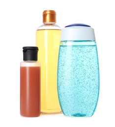 Photo of Bottles of different personal hygiene products on white background