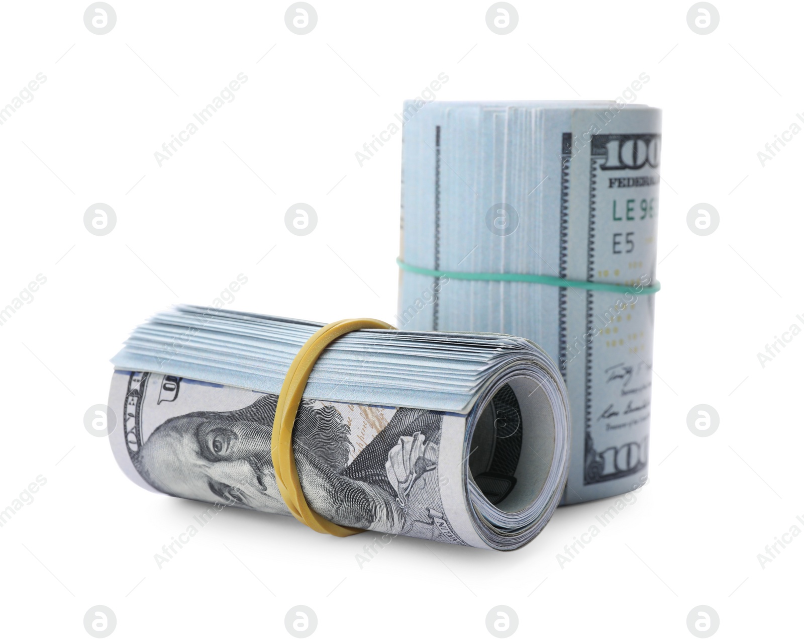 Photo of Rolled dollar banknotes on white background. American national currency