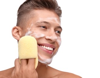 Photo of Happy young man washing his face with sponge on white background