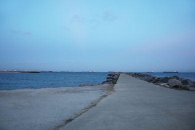 Photo of Picturesque view of beautiful beach with pier