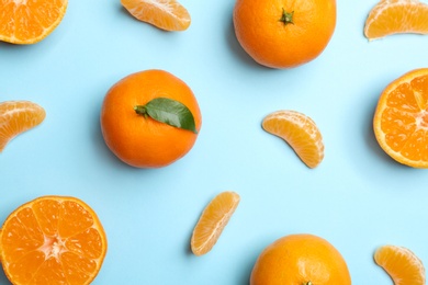 Composition with tangerines on color background, flat lay