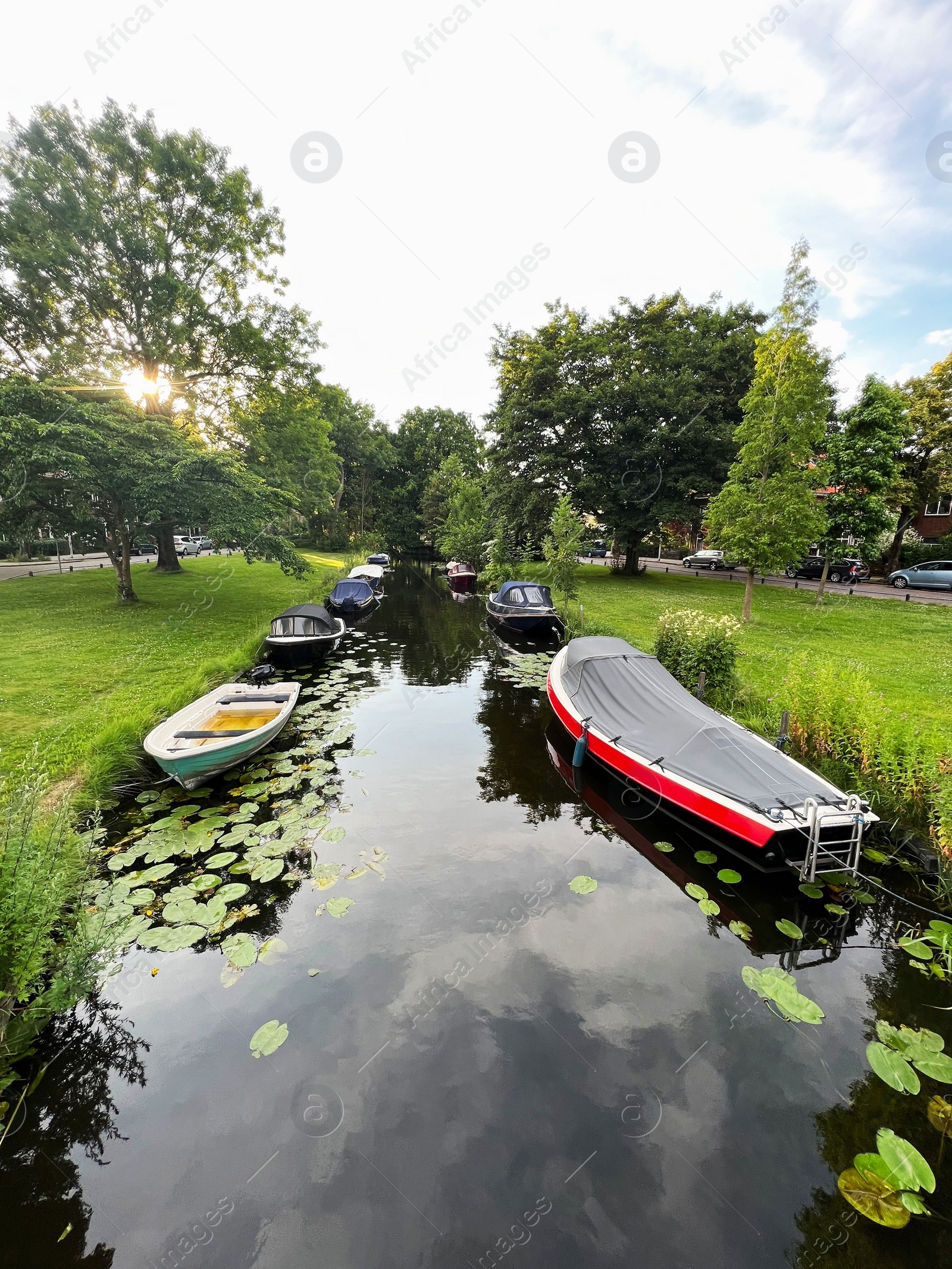 Photo of Beautiful view of moored boats in canal on sunny day