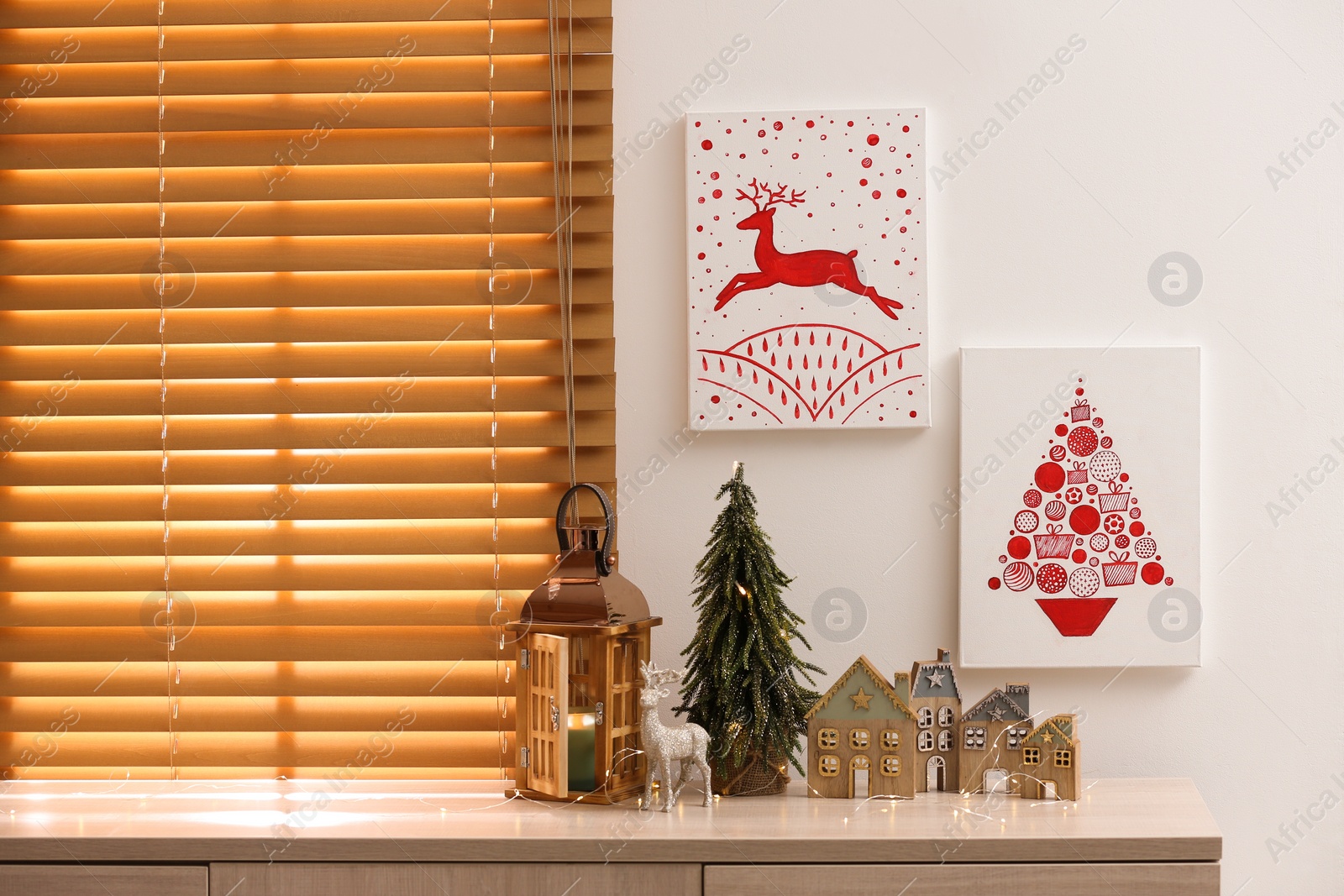 Photo of Beautiful Christmas pictures in decorated room. Interior design