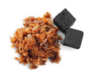 Photo of Pile of hookah tobacco and charcoal cubes on white background, top view