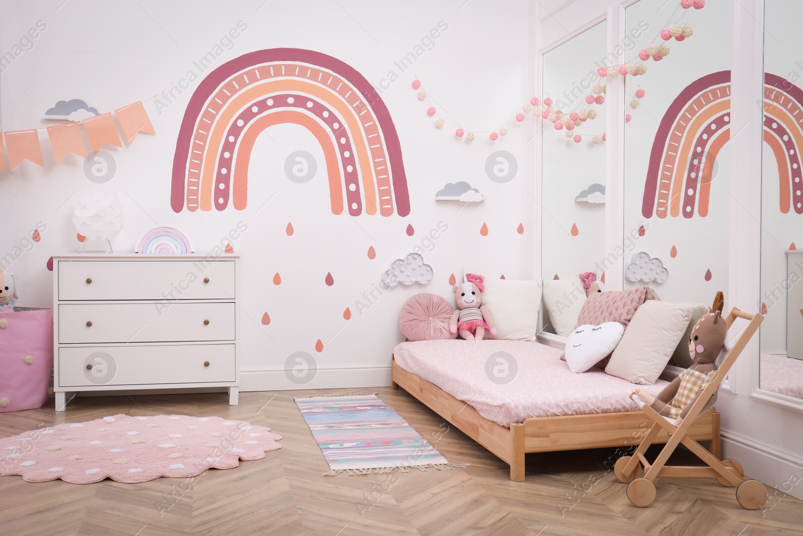 Photo of Montessori bedroom interior with floor bed and toys