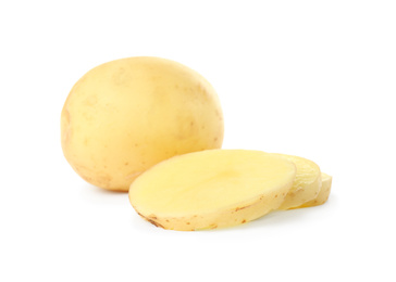 Photo of Whole and cut fresh raw organic potatoes on white background