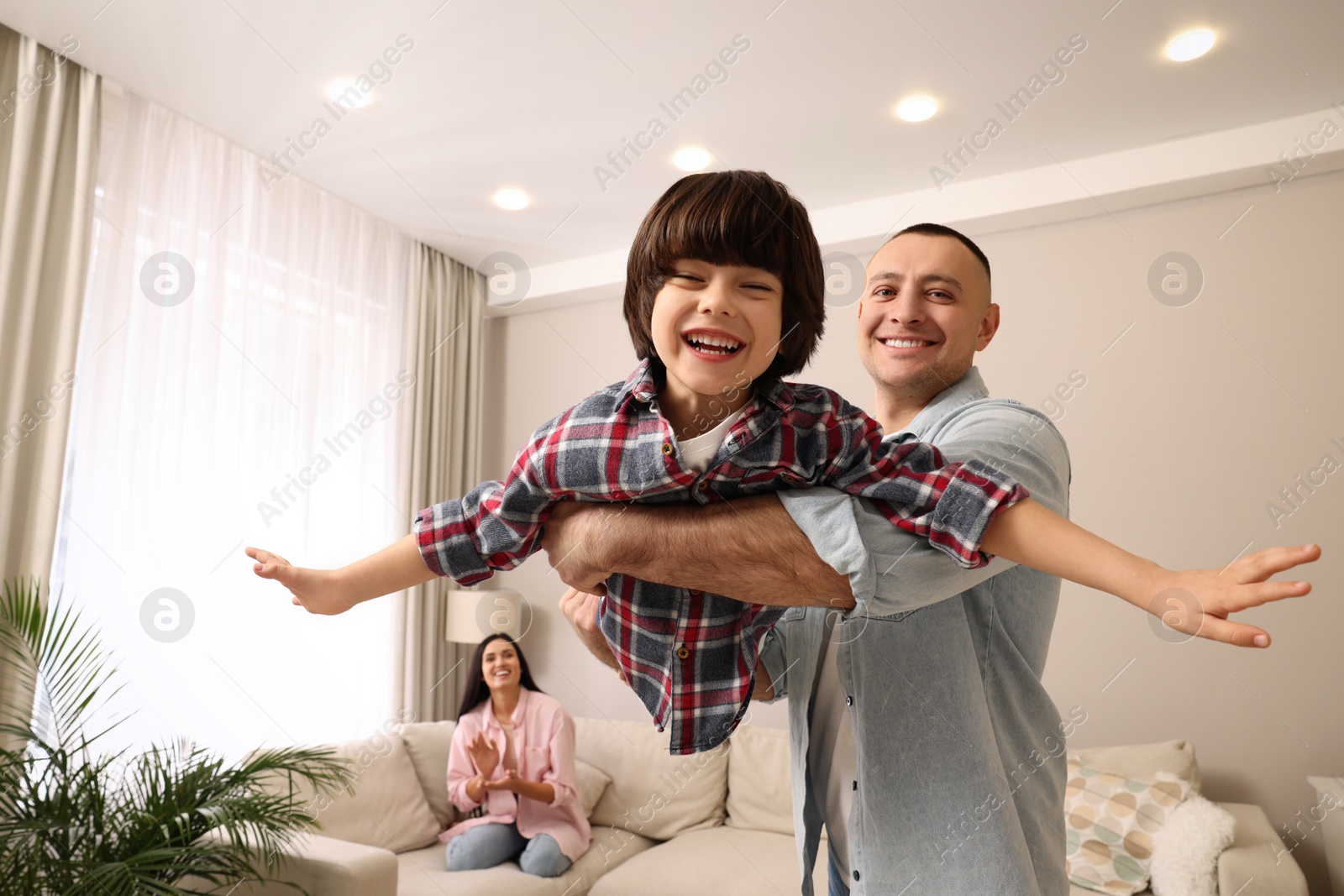 Photo of Happy family spending time together at home