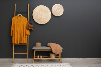 Photo of Hallway interior with stylish furniture, clothes and accessories