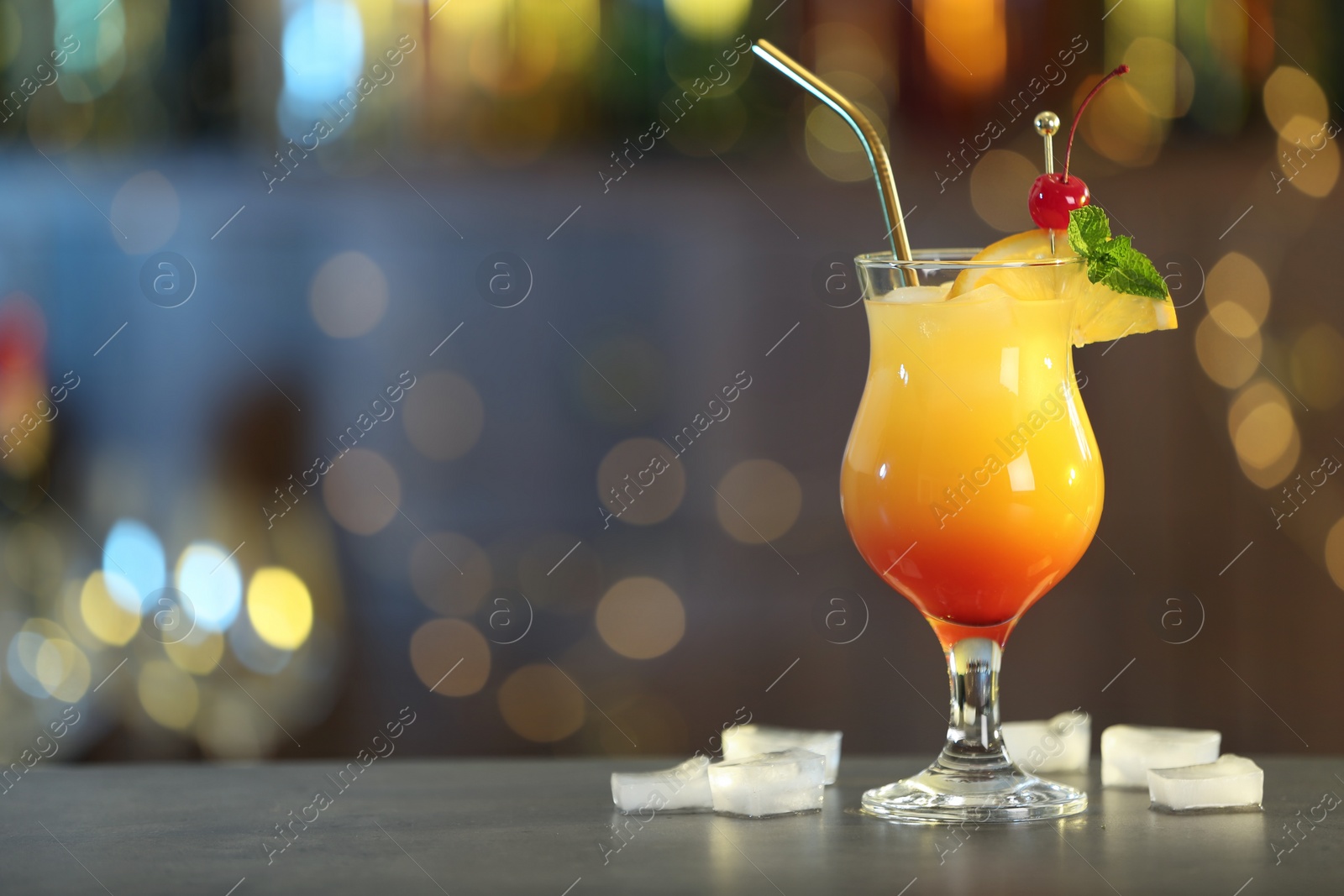 Photo of Just made appetizing cocktail Sex on the Beach in bar. Space for text