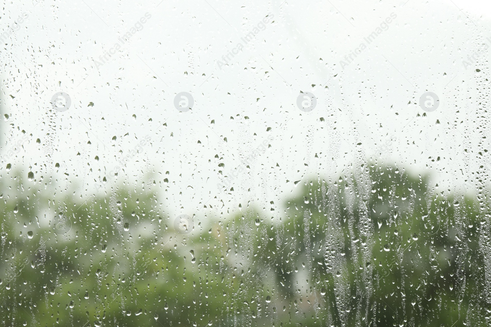 Photo of Window glass with raindrops as background, closeup