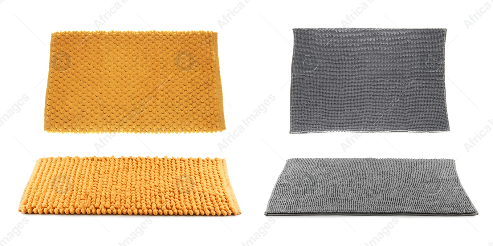 Image of Set with soft bath mats on white background 