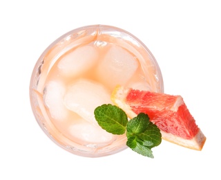Photo of Glass of grapefruit cocktail with ice isolated on white, top view