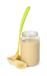 Tasty baby food in jar, spoon and fresh banana isolated on white