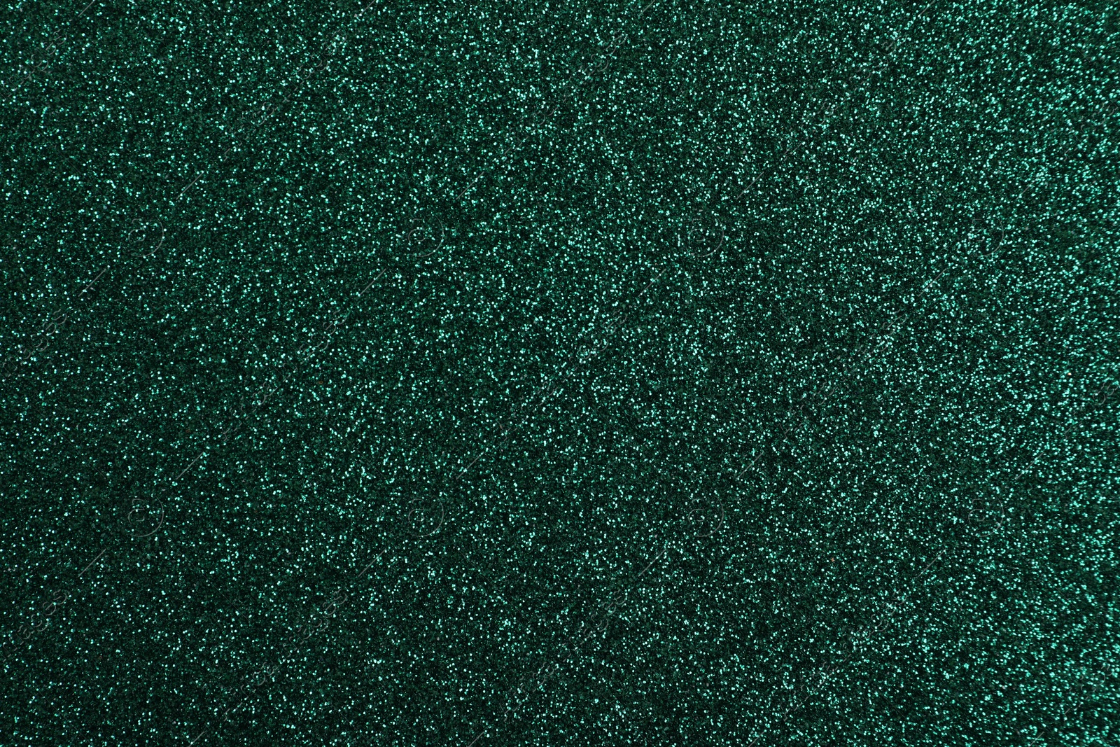 Photo of Shiny dark green glitter as background, closeup