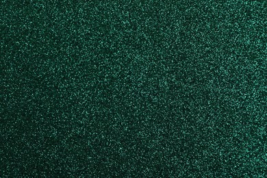 Shiny dark green glitter as background, closeup