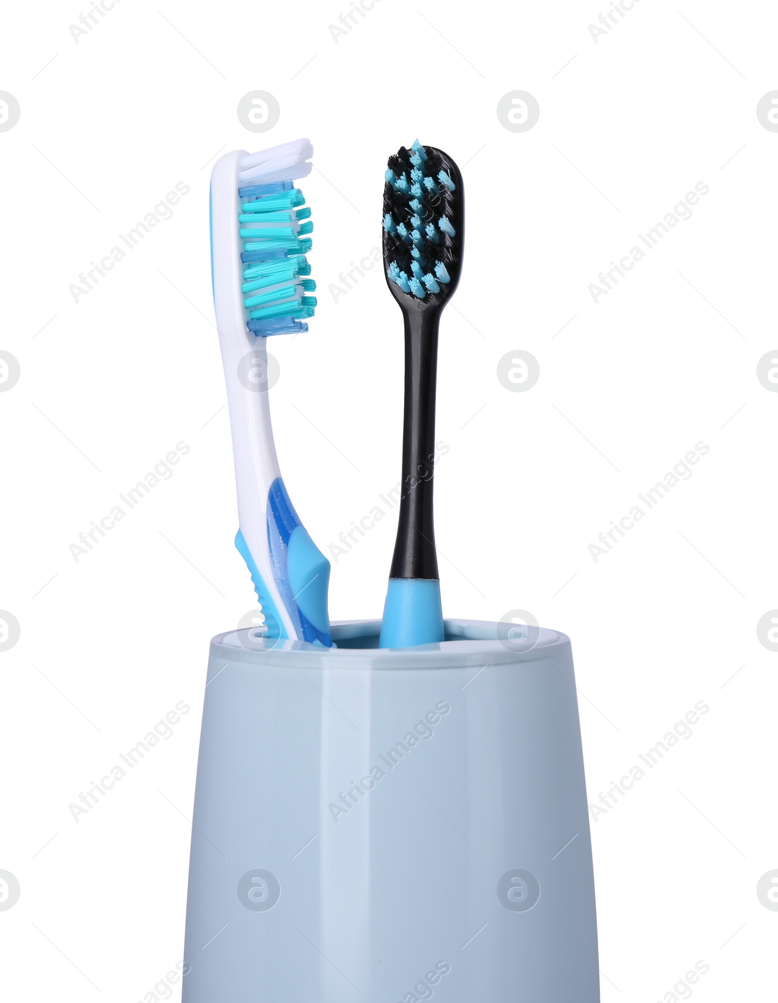 Photo of Two plastic toothbrushes in holder isolated on white