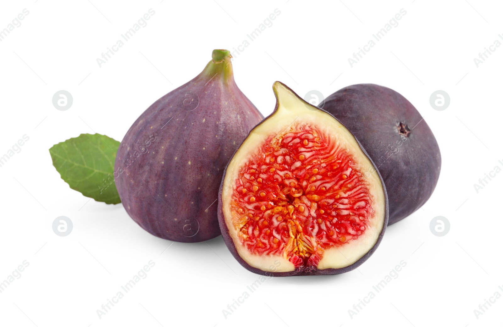 Photo of Cut and whole ripe figs isolated on white