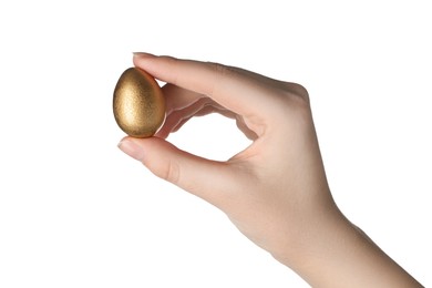 Photo of Woman holding golden quail egg on white background, closeup