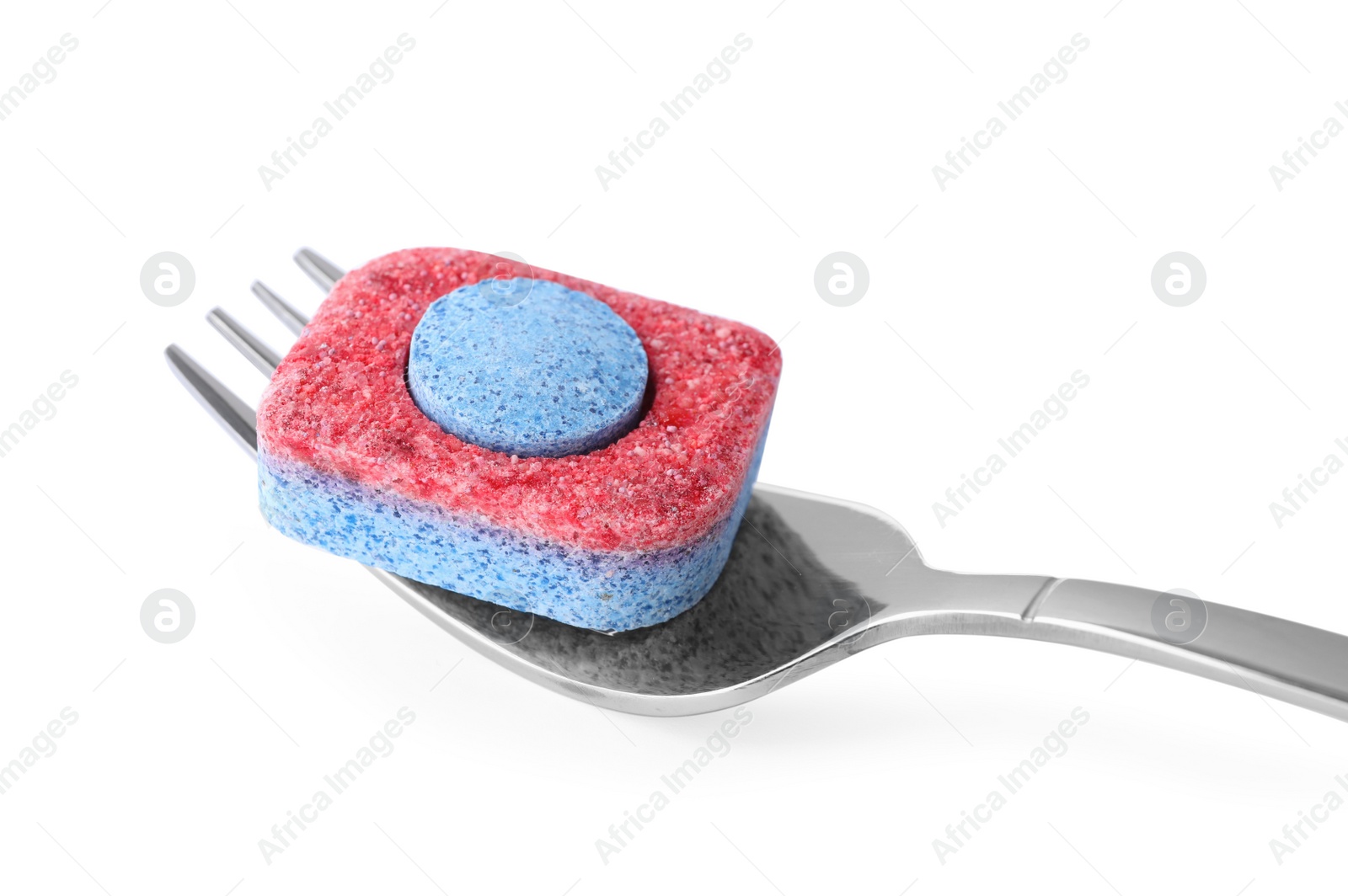 Photo of Fork with dishwasher detergent tablet on white background, closeup