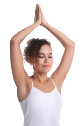 Photo of Beautiful African-American woman meditating on white background