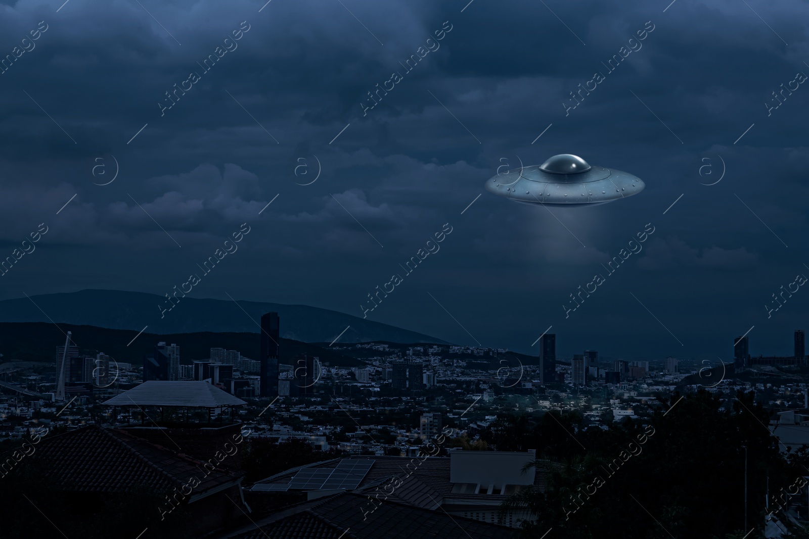 Image of Alien spaceship flying over city in evening. UFO, extraterrestrial visitors