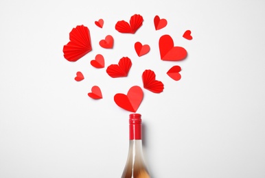 Photo of Creative flat lay composition with bottle of champagne on white background