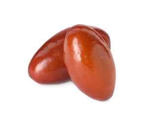 Two ripe red dates on white background