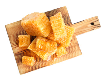 Photo of Board with fresh honeycombs isolated on white, top view