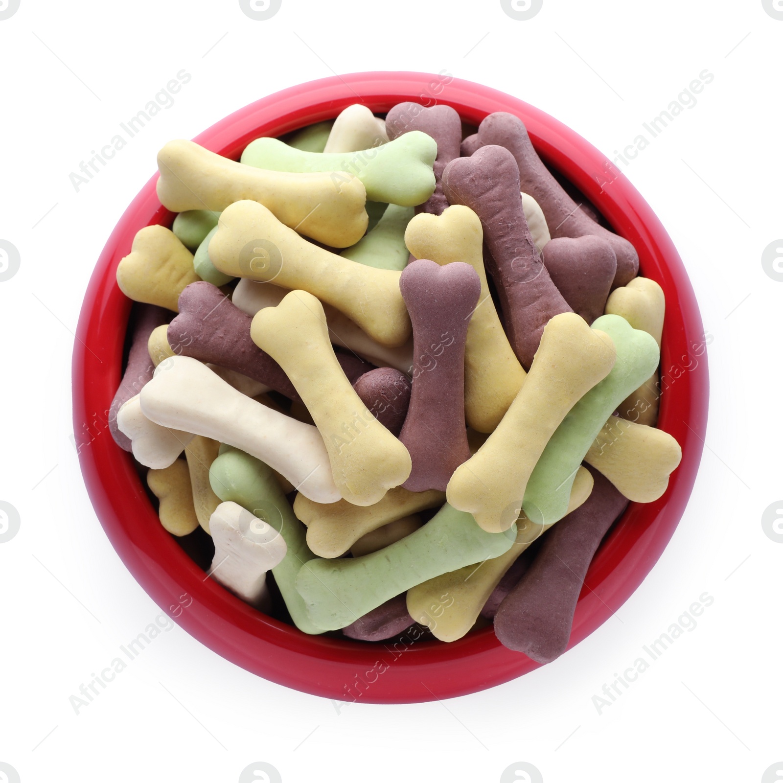 Photo of Different bone shaped dog cookies in feeding bowl isolated on white, top view