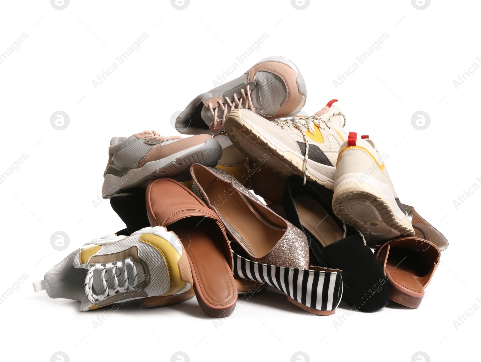 Photo of Pile of different shoes on white background