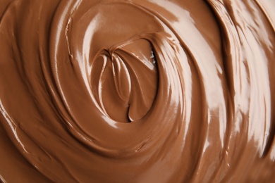 Photo of Sweet tasty chocolate cream as background, closeup