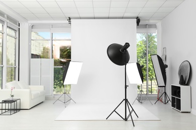 Interior of modern photo studio with professional equipment