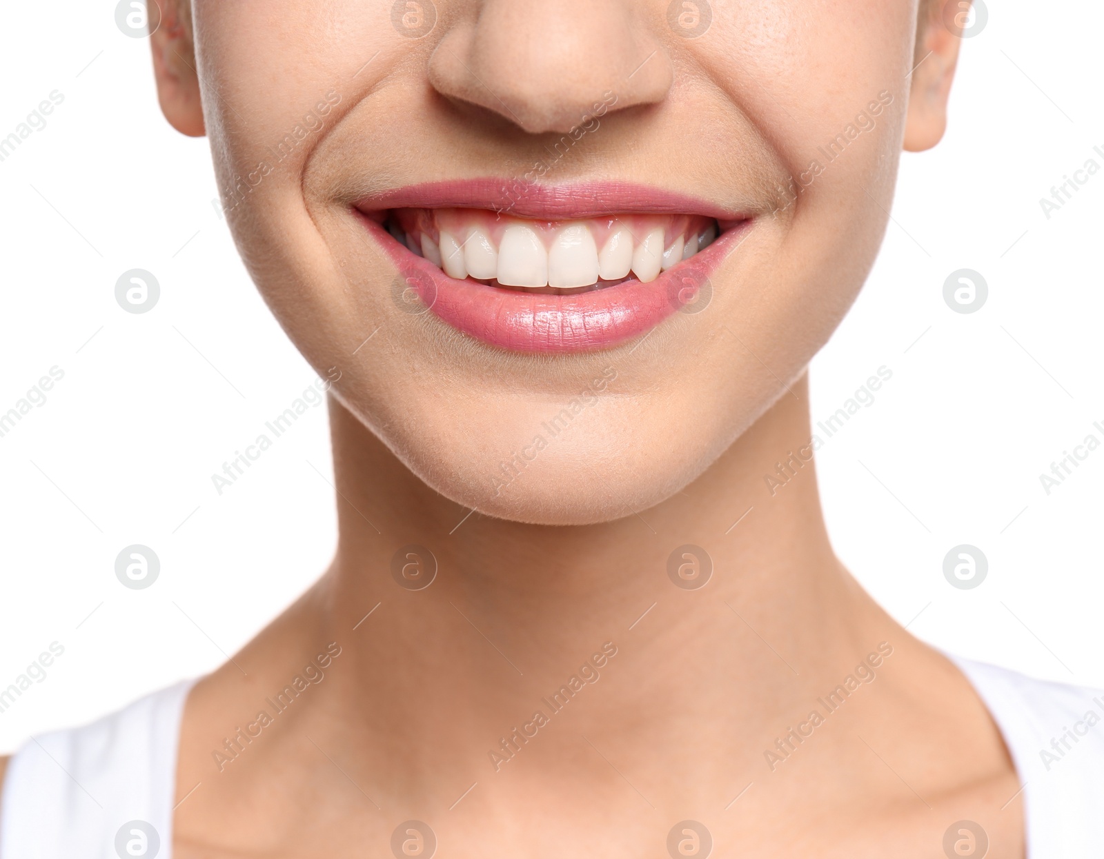 Photo of Young woman with beautiful smile on white background, closeup. Teeth whitening