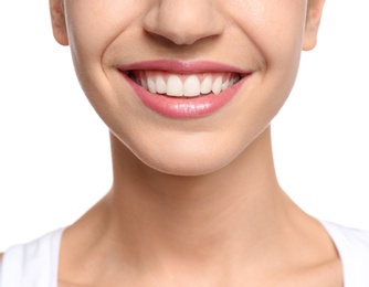 Photo of Young woman with beautiful smile on white background, closeup. Teeth whitening