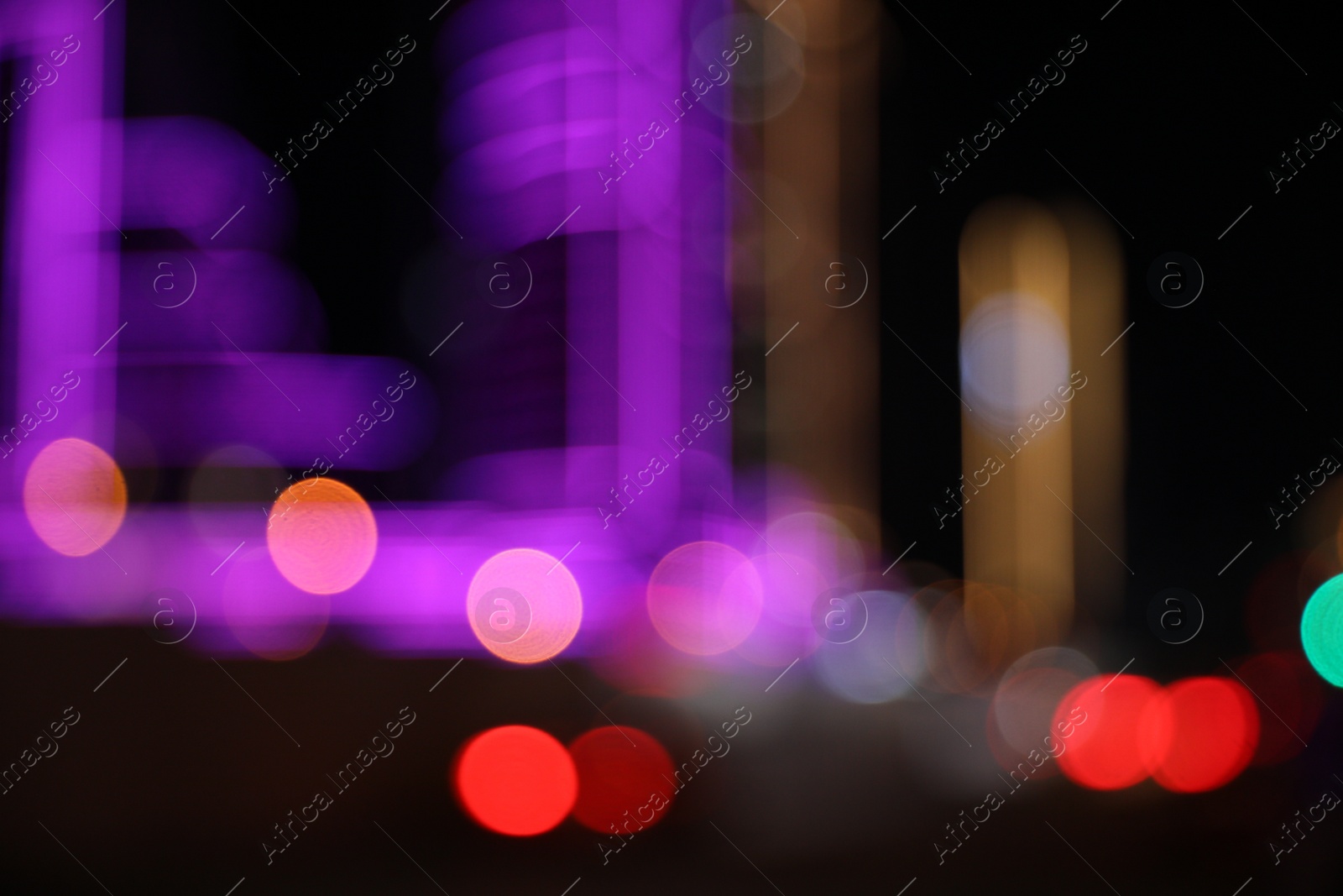 Photo of Blurred view of cityscape with bokeh effect. Night life