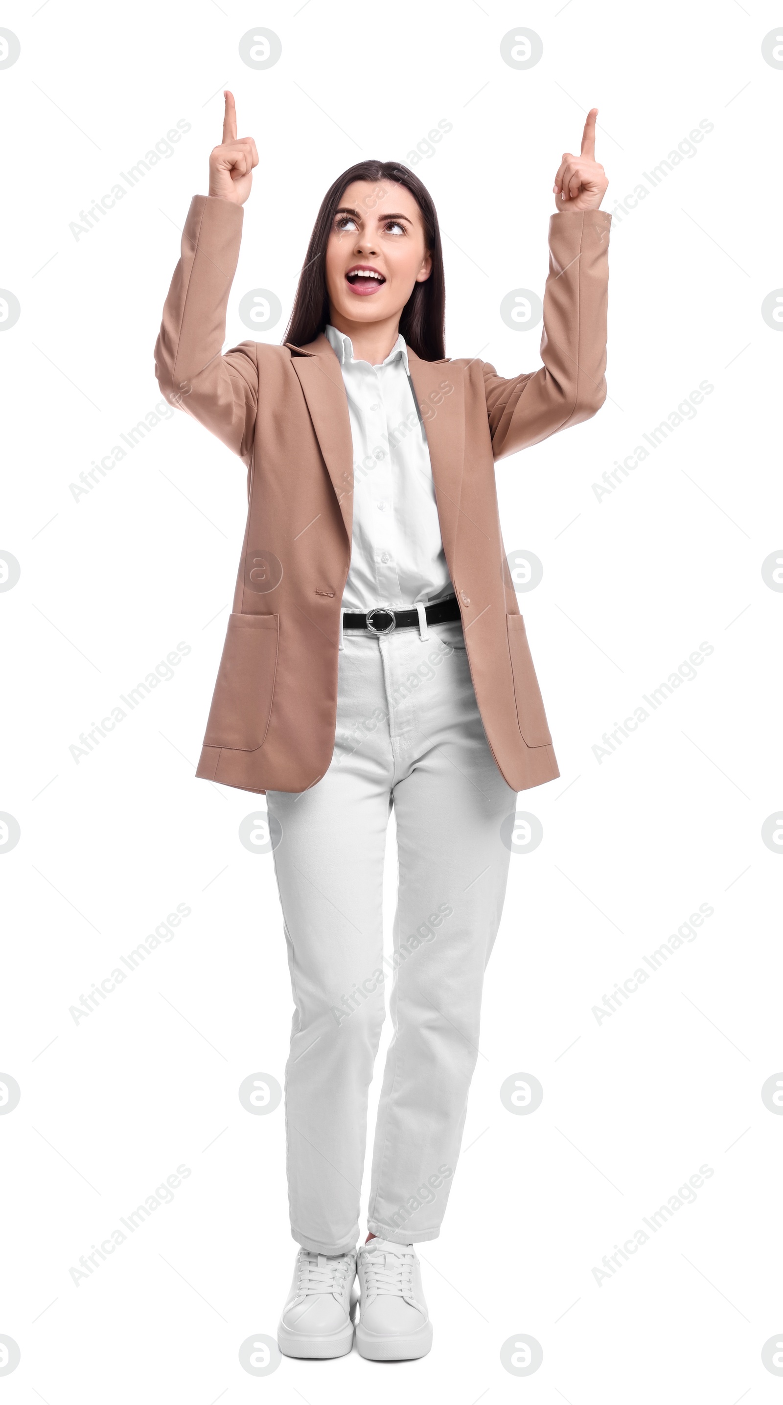 Photo of Beautiful businesswoman in suit pointing at something on white background