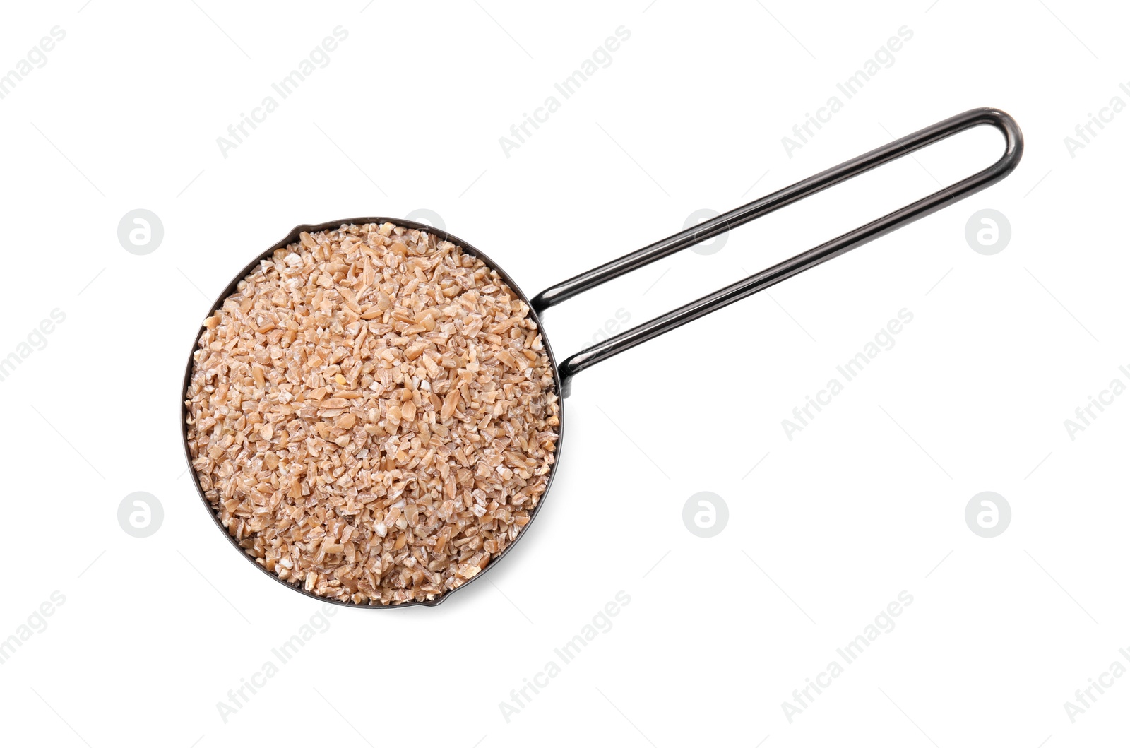 Photo of Dry wheat groats in scoop isolated on white, top view