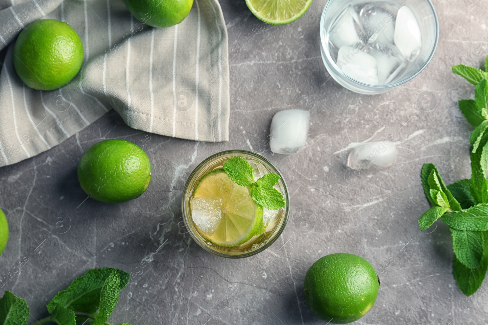 Photo of Flat lay composition with delicious mint julep cocktail on grey background