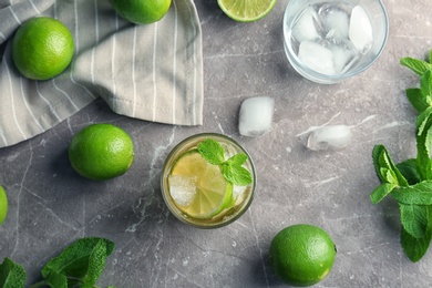 Flat lay composition with delicious mint julep cocktail on grey background