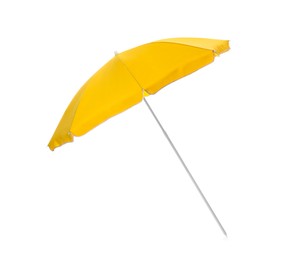 Photo of Open yellow beach umbrella isolated on white