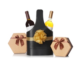 Photo of Festive package with bottles of wine and gift boxes on white background