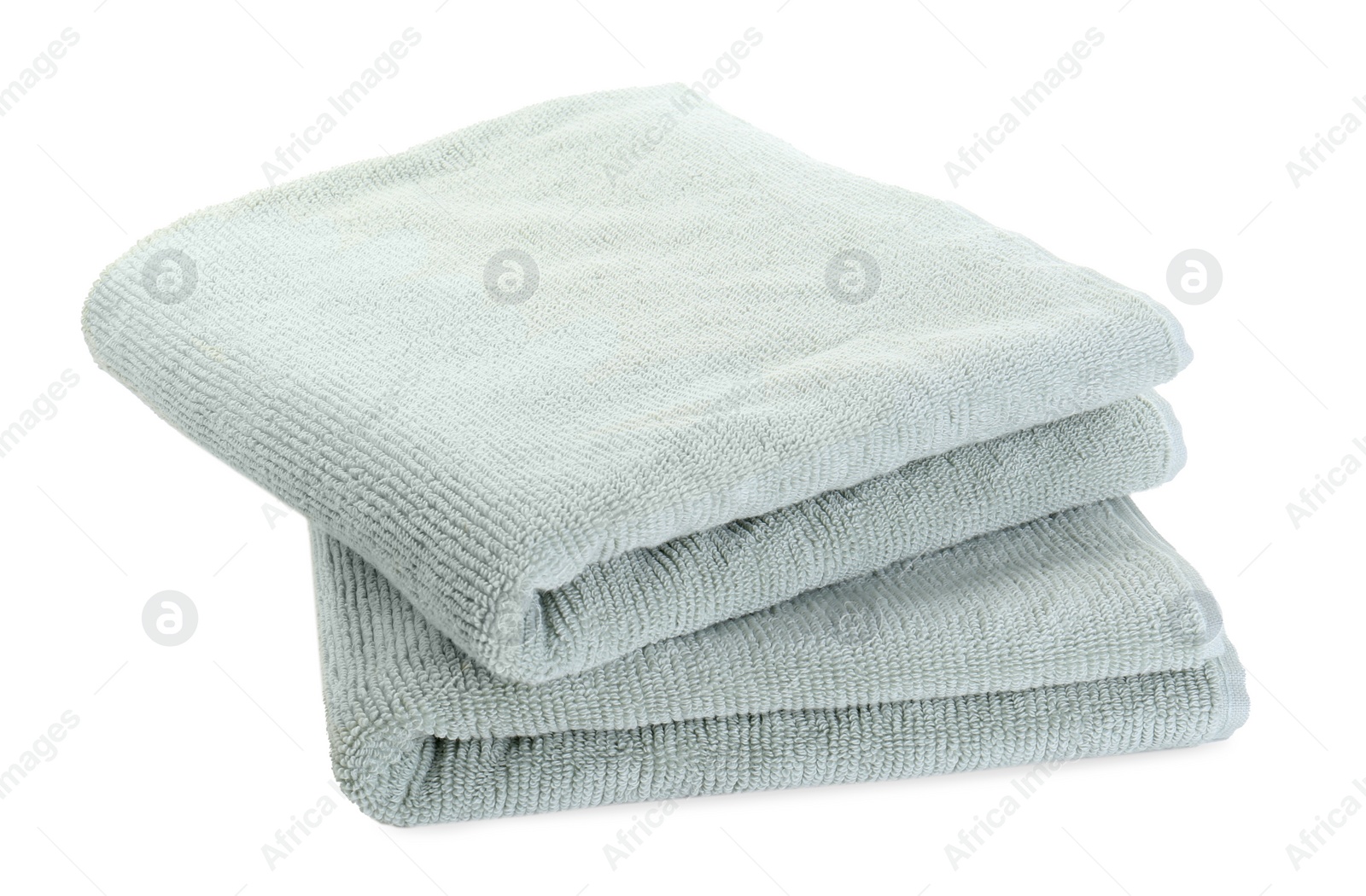 Photo of Soft folded terry towels isolated on white