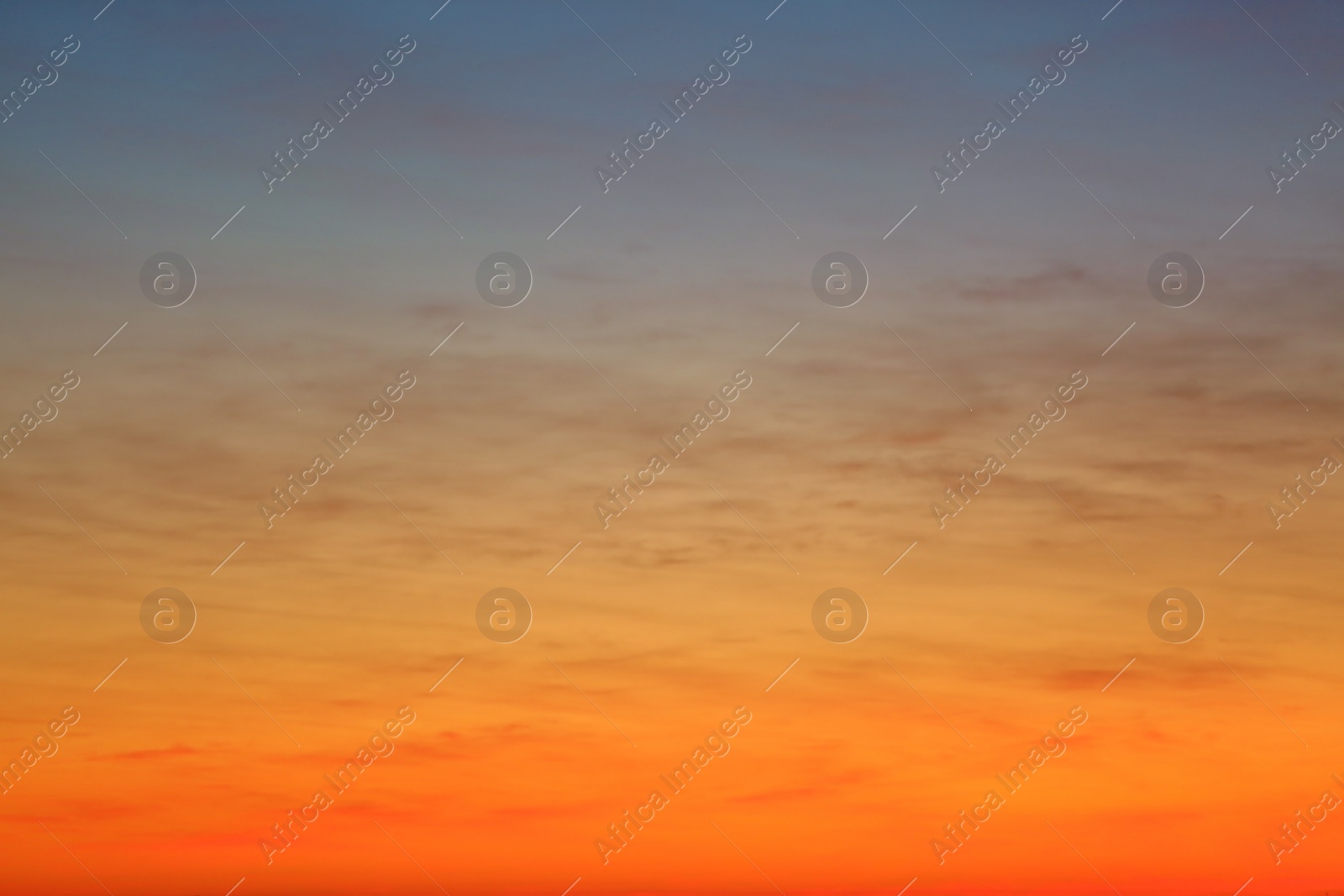 Photo of Picturesque view of beautiful sky lit by setting sun