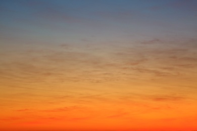 Photo of Picturesque view of beautiful sky lit by setting sun